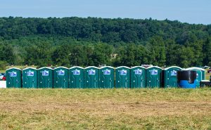 Portable Toilets lined up in a field